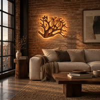 Wall sconce shaped like branching coral with open carved limbs in an industrial loft living room with exposed brick