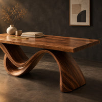 Corner detail of rectangular desk on a single flowing wave shaped wood base beside wood, brass and linen samples