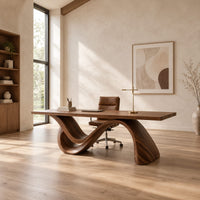 Rectangular desk on a single flowing wave shaped wood base in a bright open plan home office