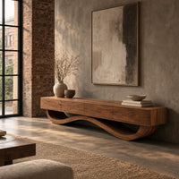Long tv stand with four flush front panels on a wave shaped base in an industrial loft living room with exposed brick