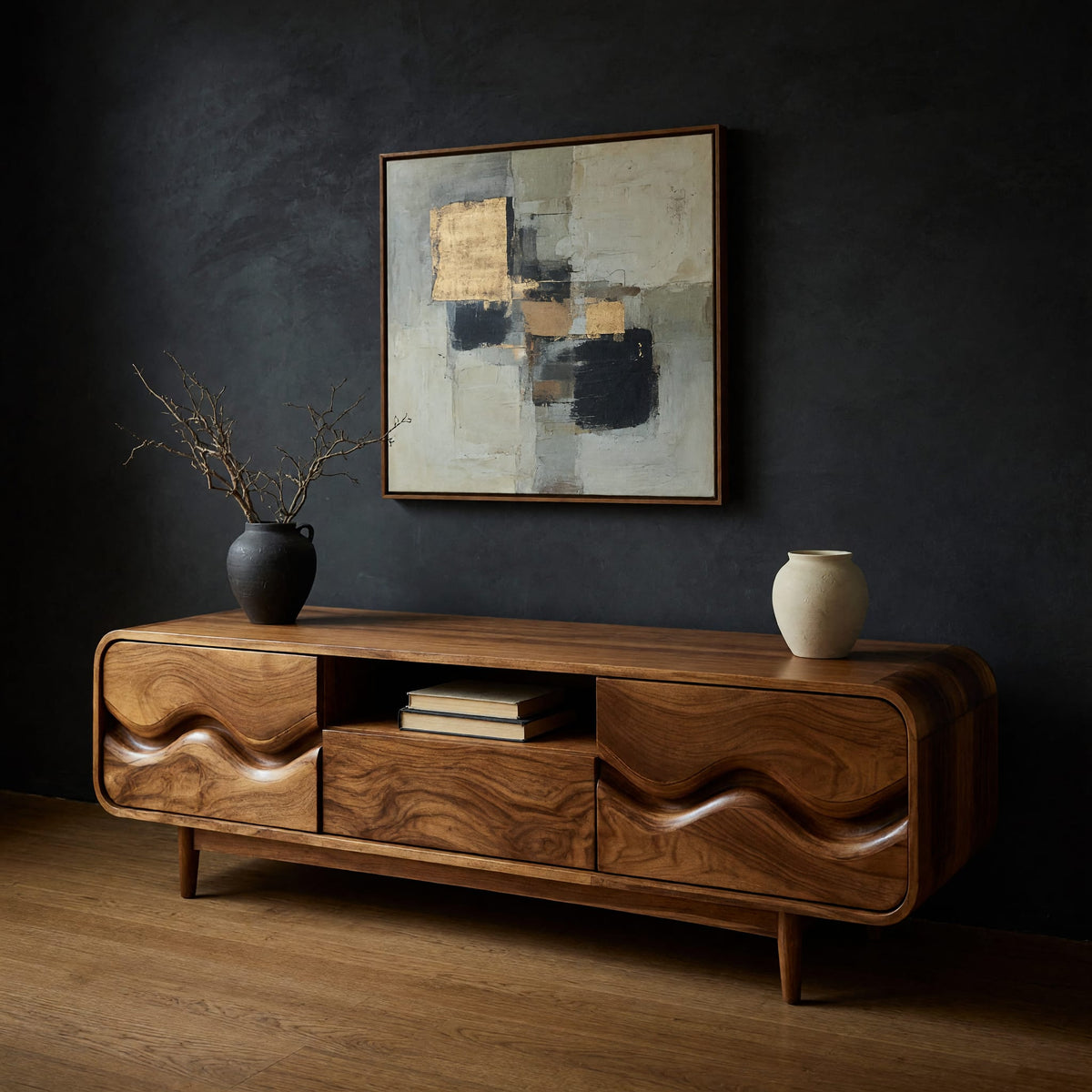 Mid century TV cabinet with wave carved doors in a dark studio against a charcoal wall