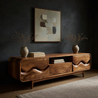 Mid century TV cabinet with wave carved doors, three-quarter view showing the grain