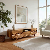 Mid century TV cabinet with wave carved doors in a bright modern living room