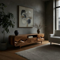 Mid century TV cabinet with wave carved doors in a concrete and timber loft