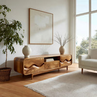 Mid century TV cabinet with wave carved doors in an open plan space in daylight