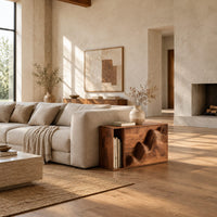 End table with a carved wave front and an open side compartment in a bright open plan living room