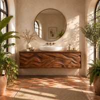 Long floating bathroom vanity cabinet with three wave carved front panels in a bright bathroom with arched windows and plants