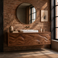 Long floating bathroom vanity cabinet with three wave carved front panels in an industrial loft bathroom with exposed brick