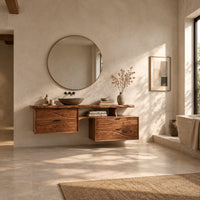 Floating bathroom vanity with offset wave carved fronts and a slab top in a bright open plan bathroom