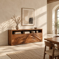 Low sideboard with three carved wave panels and an open display shelf above in a bright open plan dining room