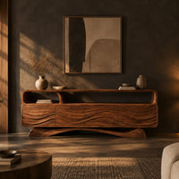 Tv stand with wave carved panels, an open top shelf and an arched base in a dark living room at golden hour