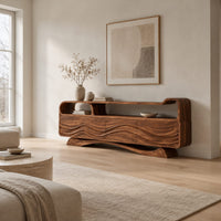 Tv stand with wave carved panels, an open top shelf and an arched base in a Scandinavian living room with white walls