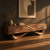 Tv stand with a wave carved cabinet on a sweeping sculpted base, three-quarter view showing the grain