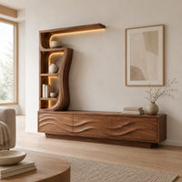 Low wave carved cabinet with a tall open shelf tower and a top shelf in a Scandinavian living room with white walls