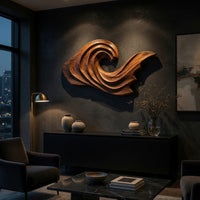 Wooden wave crest wall art with a tapering tail on a dark charcoal plaster wall