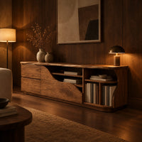 Low wooden tv stand with a wave cut front and upright slots in an evening living room with walnut wall paneling