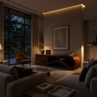 Wave end TV stand with a two drawer block in an evening room lit by two lamps