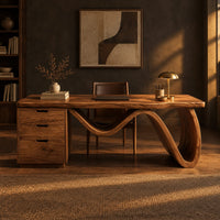 Desk with a thick slab top, three drawer pedestal and a wave shaped leg in a dark home office at golden hour
