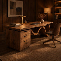 Desk with a thick slab top, three drawer pedestal and a wave shaped leg in an evening home office with walnut wall paneling