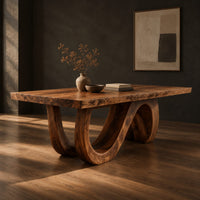 Dining table with a live edge top and a looping wave base, three-quarter view showing the grain