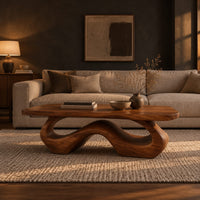 Rectangle coffee table with softly shaped corners on a flowing wave loop base in a dark living room at golden hour