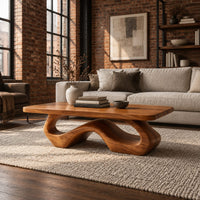 Rectangle coffee table with softly shaped corners on a flowing wave loop base in an industrial loft living room with exposed brick