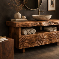 Corner detail of bathroom vanity with wave carved fronts and a live edge top beside wood, brass and linen samples