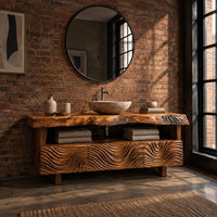 Bathroom vanity with wave carved fronts and a live edge top in an industrial loft bathroom with exposed brick