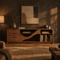 Tv stand with three drawers and a wave shaped center panel in a dark living room at golden hour