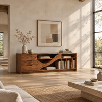 Tv stand with three drawers and a wave shaped center panel in a bright open plan living room