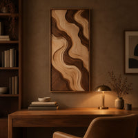 Wall art panel with flowing two tone wave relief in a slim frame above a desk in a dark study corner