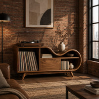 Low wooden record player stand with a wavy top and open record bay in an industrial loft living room with exposed brick