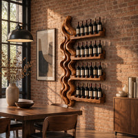 Wine rack with a tall wavy backbone and four notched shelf arms in an industrial loft dining room with exposed brick