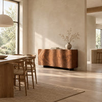 Wavy edged sideboard with two front panels and bold wood grain in a bright open plan dining room