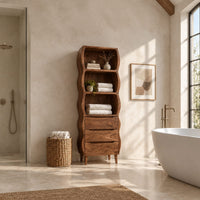 Tall bathroom cabinet with three wavy open shelves and three drawers in a bright open plan bathroom