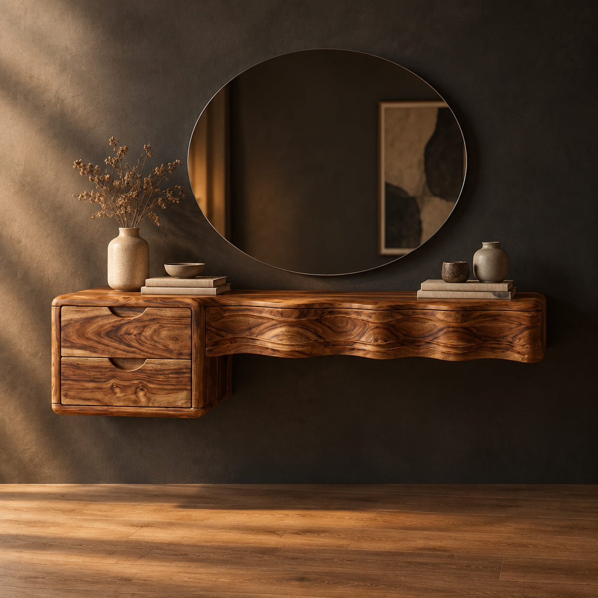 Floating wood makeup vanity with a wavy carved front and two small drawers in a dark studio against a charcoal plaster wall