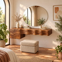 Floating wood makeup vanity with a wavy carved front and two small drawers in a bright bedroom with arched windows and plants