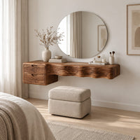 Floating wood makeup vanity with a wavy carved front and two small drawers in a Scandinavian bedroom with white walls