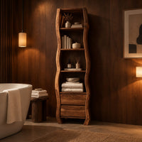 Tall narrow cabinet with wavy sides, four open shelves and two drawer fronts below in an evening bathroom with walnut wall paneling