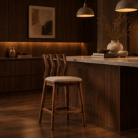 Bar stool with a wavy slatted back and a padded seat in an evening kitchen with walnut wall paneling