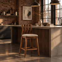 Bar stool with a wavy slatted back and a padded seat in an industrial loft kitchen with exposed brick