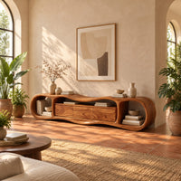 Wavy tv stand with open oval end bays and a three panel center in a bright living room with arched windows and plants