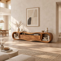 Wavy tv stand with open oval end bays and a three panel center in a bright open plan living room