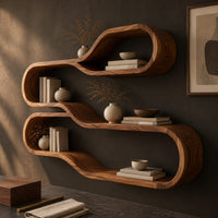 Corner detail of wall shelf of two stacked flowing loops joined by a wavy ledge beside wood, brass and linen samples