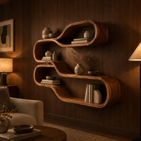 Wall shelf of two stacked flowing loops joined by a wavy ledge in an evening living room with walnut wall paneling