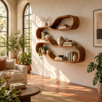 Wall shelf of two stacked flowing loops joined by a wavy ledge in a bright living room with arched windows and plants