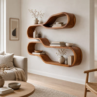 Wall shelf of two stacked flowing loops joined by a wavy ledge in a Scandinavian living room with white walls