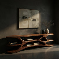 Low TV console with carved web supports between shelves, three-quarter view showing the grain
