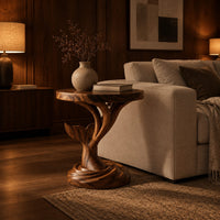 Side table with a carved whale tail on a spiral stem and coiled base in an evening living room with walnut wall paneling