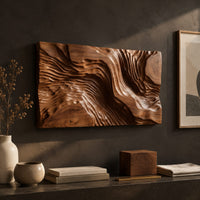 Detail of wide wood wall art carved with flowing ridges like a contour map beside wood, brass and linen samples